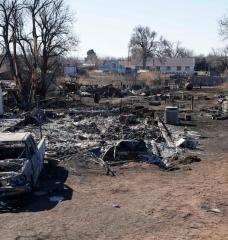 A truck and house destroyed by the Smokehouse Creek Fire are seen, Friday, March 1, 2024, in Stinnett, Texas. The wildfire became the largest in state history at over one million acres. Climatologists believe wildfires will become more common as global temperatures warm